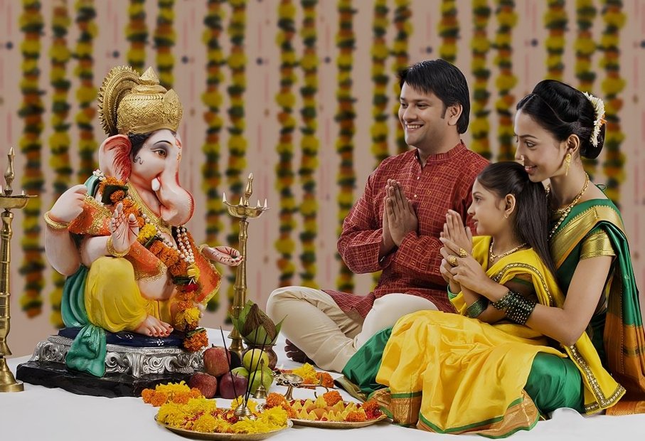 Devotees praying to Lord Ganesha for wisdom and prosperity